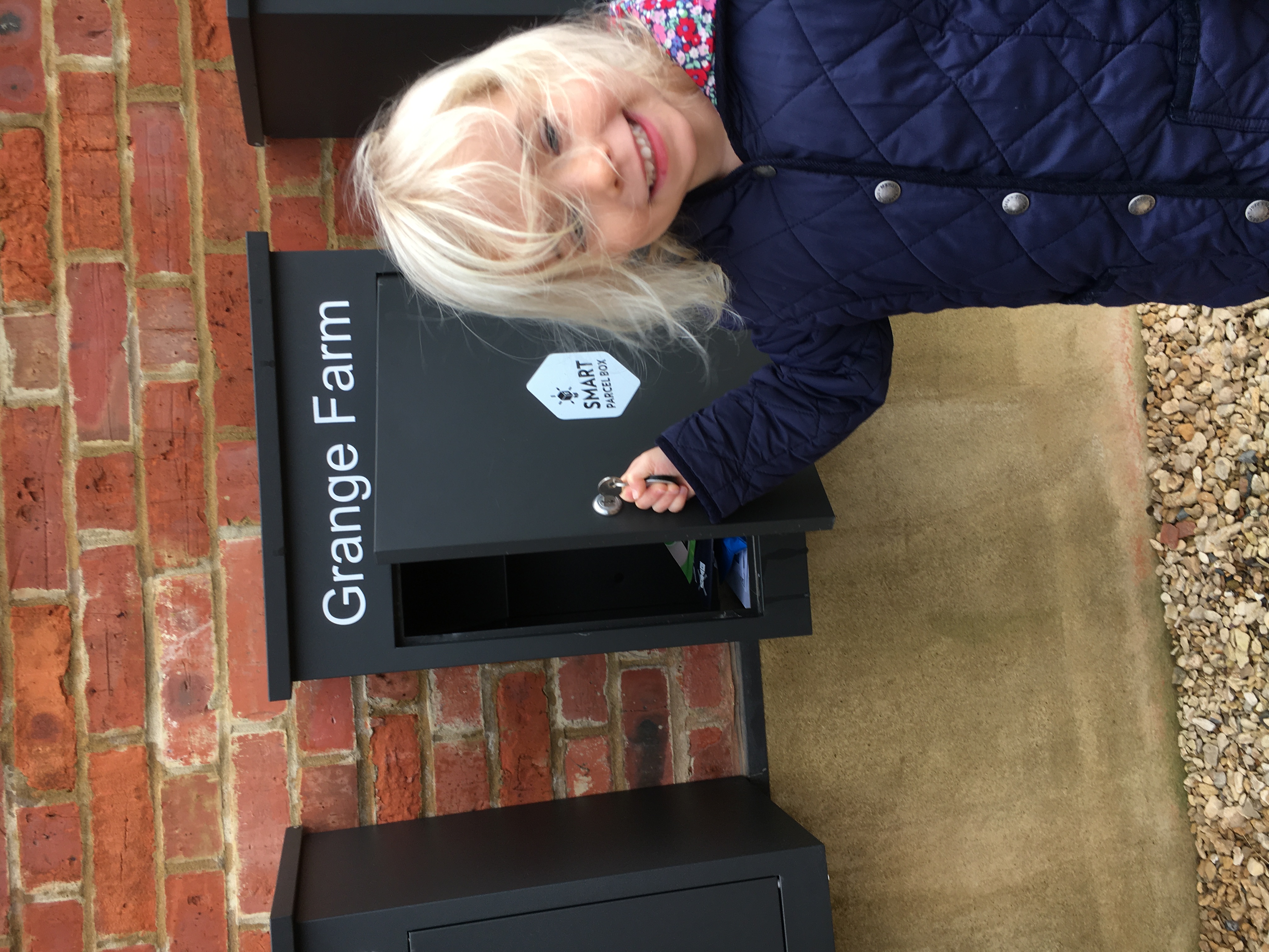Small girl with height adjustable parcel drop box